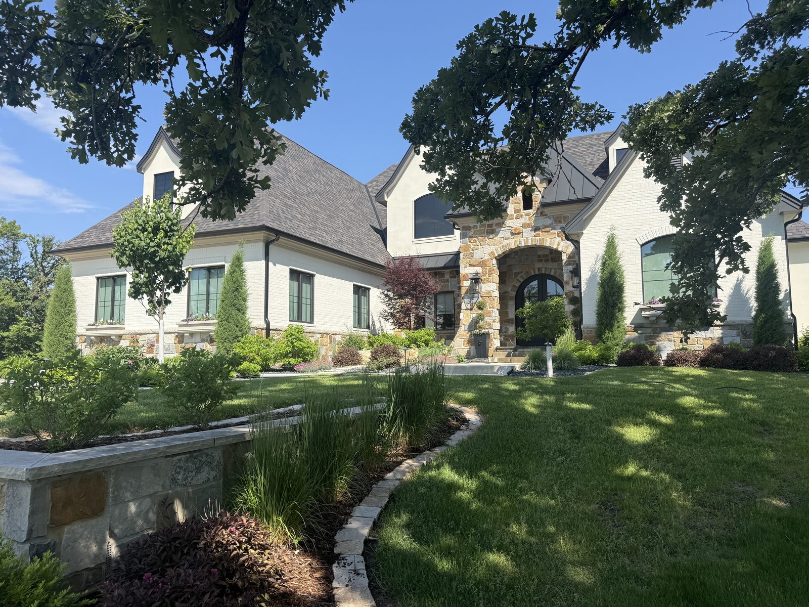Soft Washing — Stone & stucco estate by JBL Exterior Pros, central Iowa