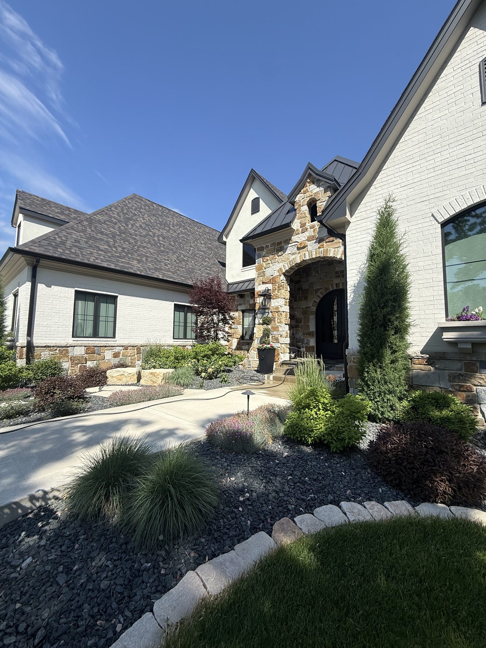 Whole-Home Care — Luxury brick home by JBL Exterior Pros, central Iowa